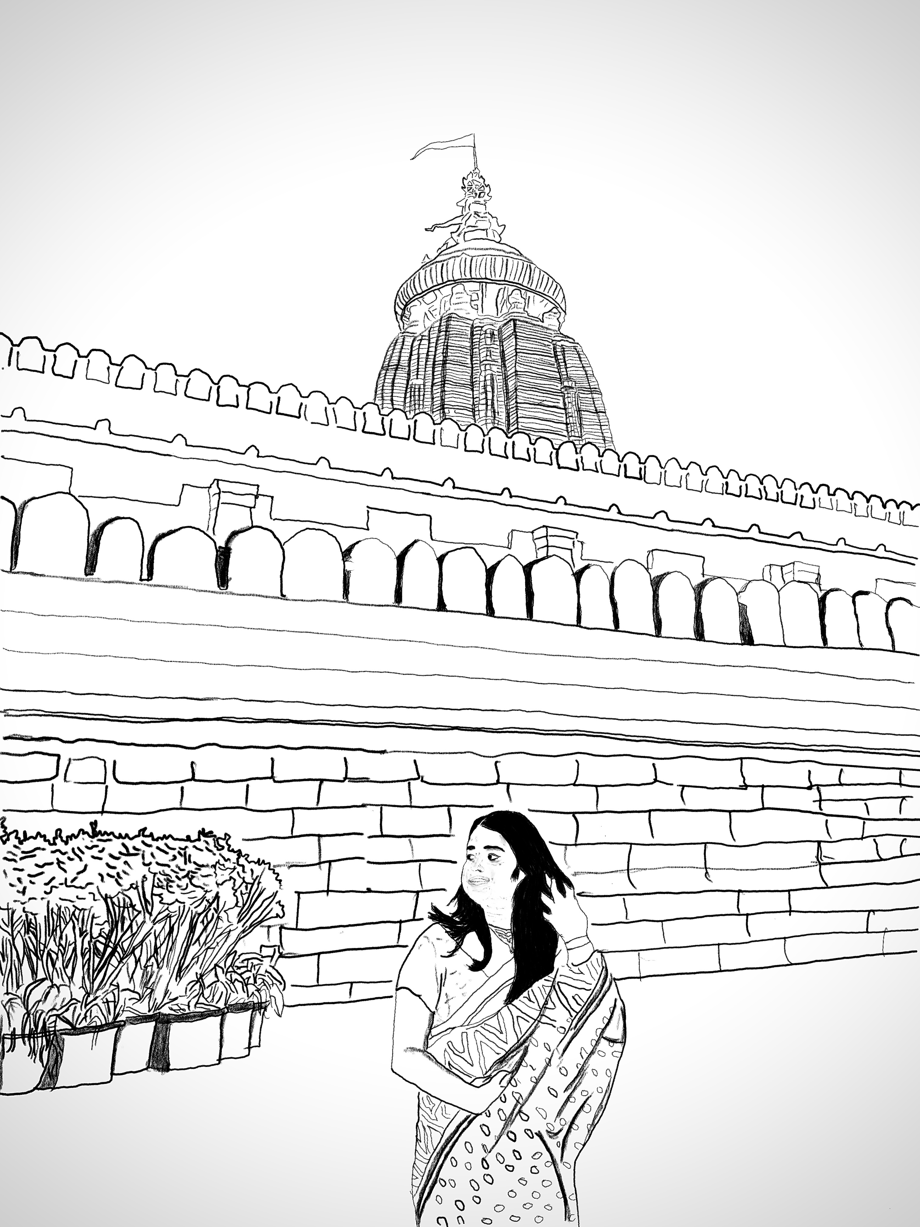 You in a sari outside the Jagannath temple at night.